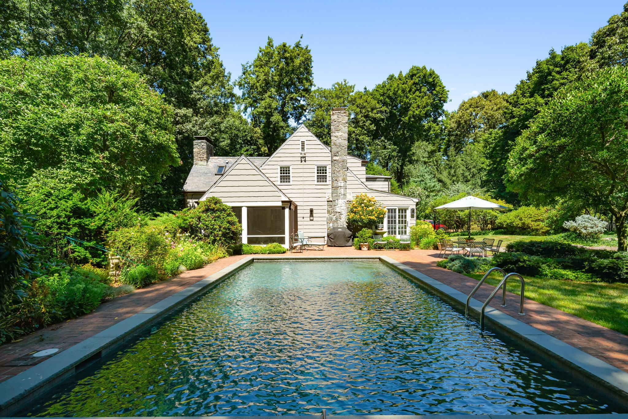 7 Point O Woods Road South Darien, CT 06820 - Photo 8 of 33 an aerial view of a house with swimming pool and large trees