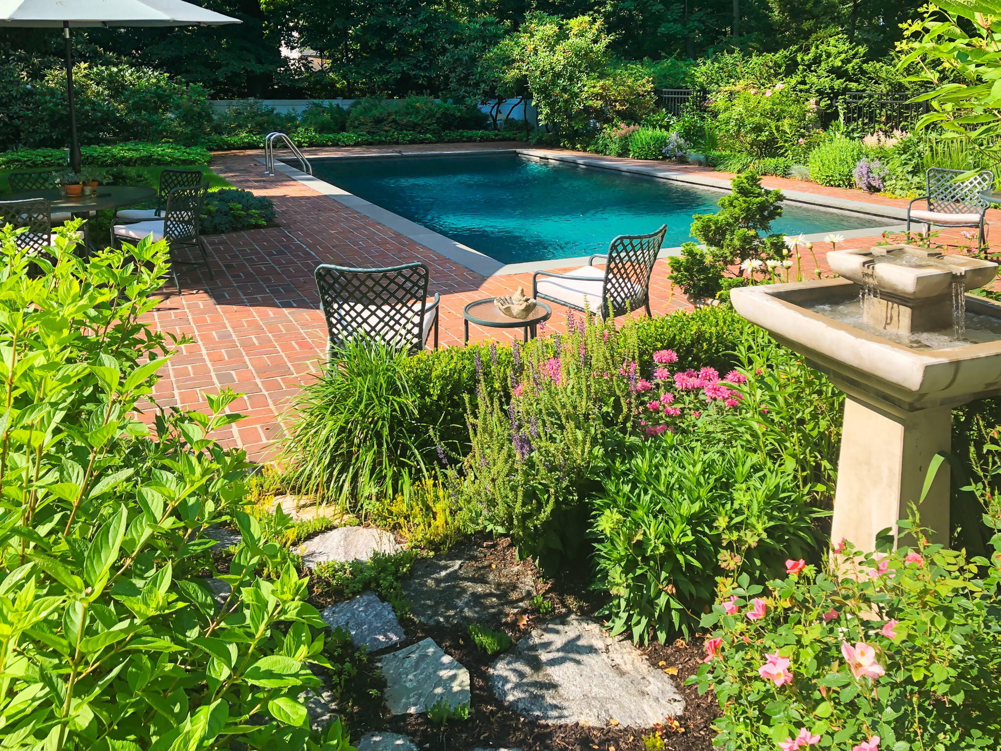 7 Point O Woods Road South Darien, CT 06820 - Photo 9 of 33 a view of a swimming pool with a patio