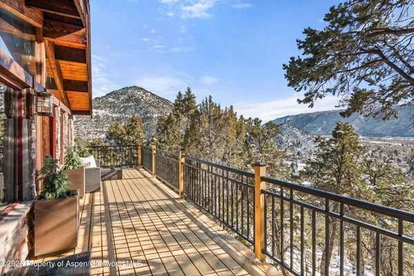 a view of balcony with wooden floor and outdoor space
