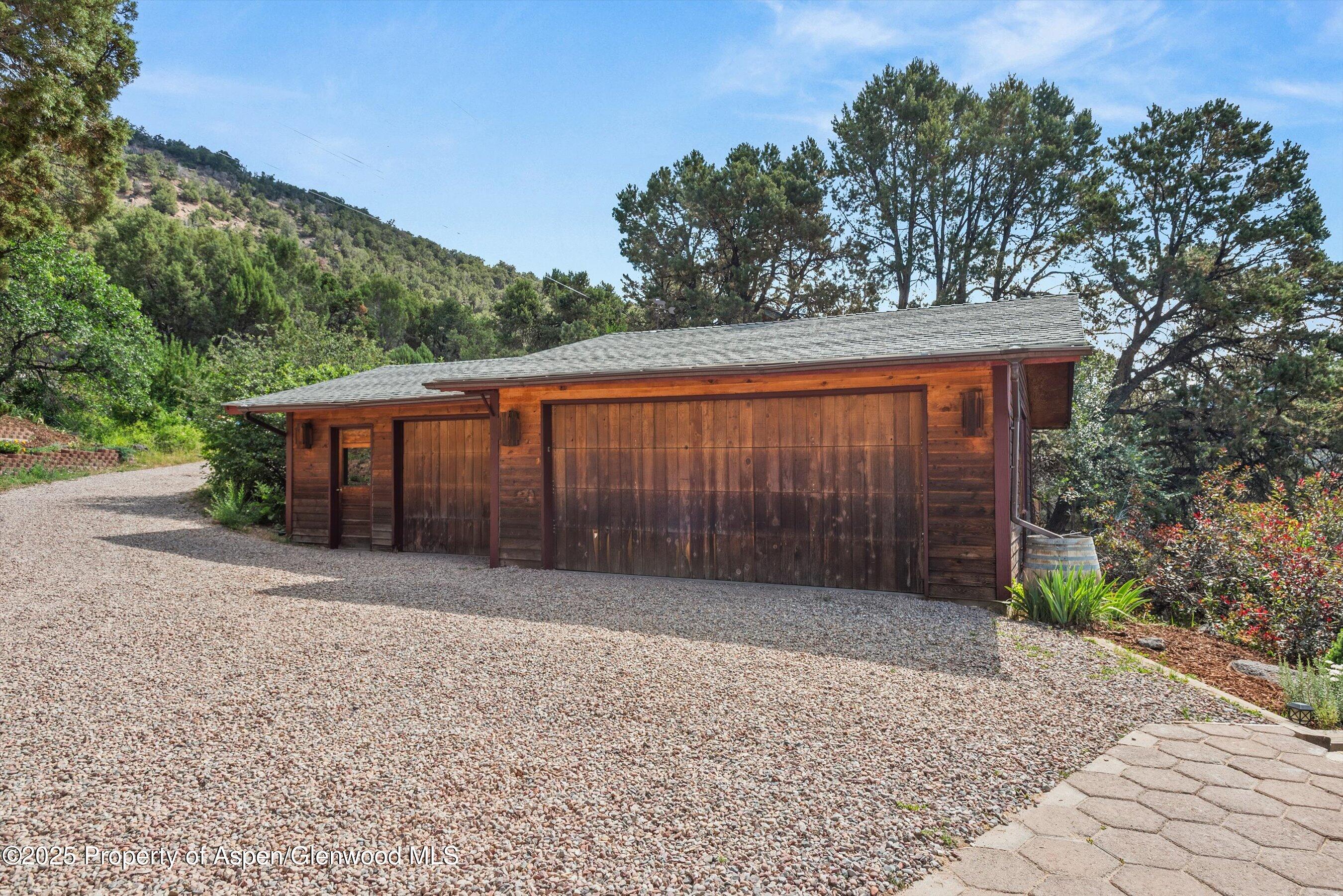679 Pinon Drive Basalt, CO 81621 - Photo 50 of 52 a view of backyard with large trees and wooden fence