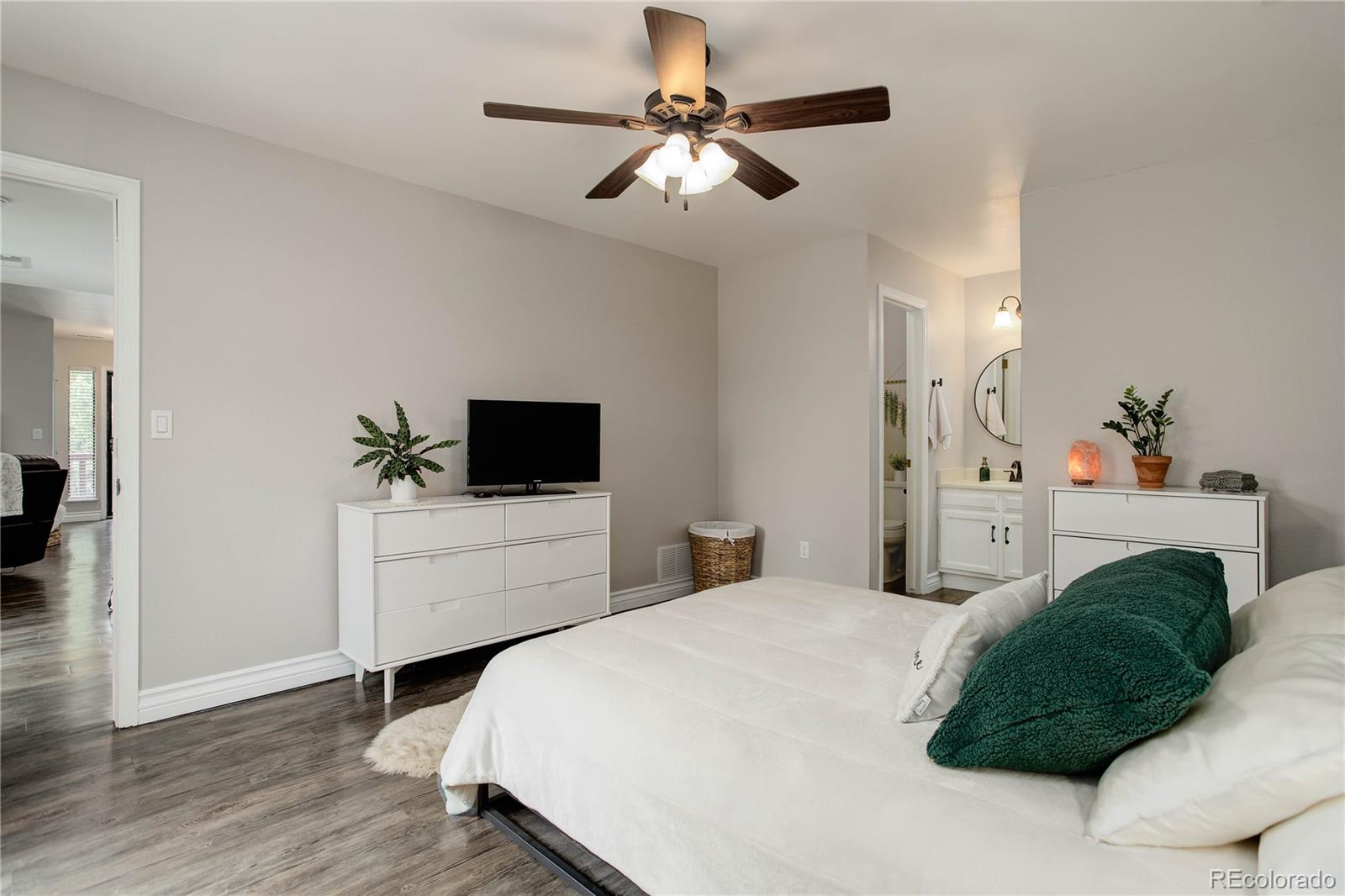 9413 West 89th Circle Westminster, CO 80021 - Photo 19 of 32 a bedroom with a bed a window and a potted plant