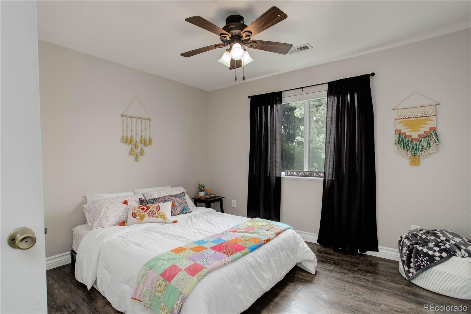 9413 West 89th Circle Westminster, CO 80021 - Photo 24 of 32 a bedroom with a bed and a window