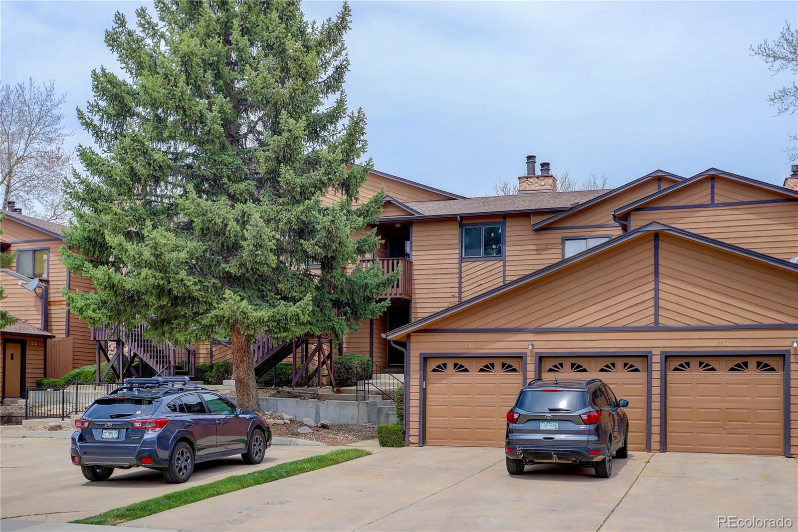9413 West 89th Circle Westminster, CO 80021 - Photo 30 of 32 a car parked in front of a house