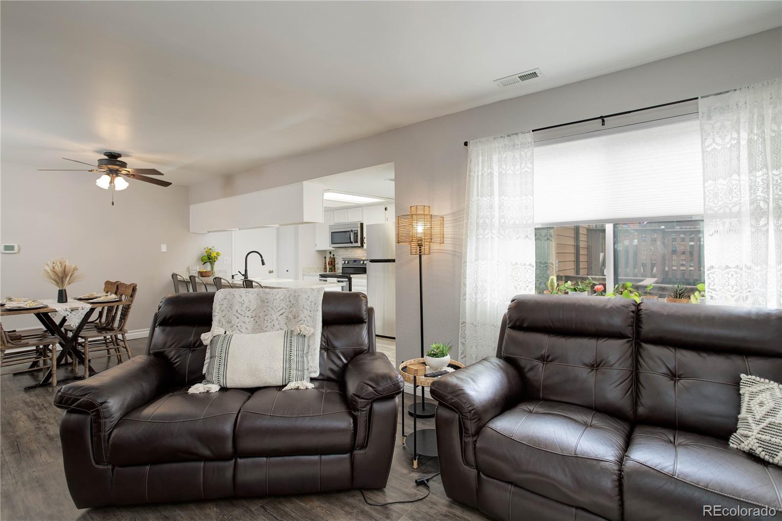 9413 West 89th Circle Westminster, CO 80021 - Photo 9 of 32 a living room with furniture and a large window