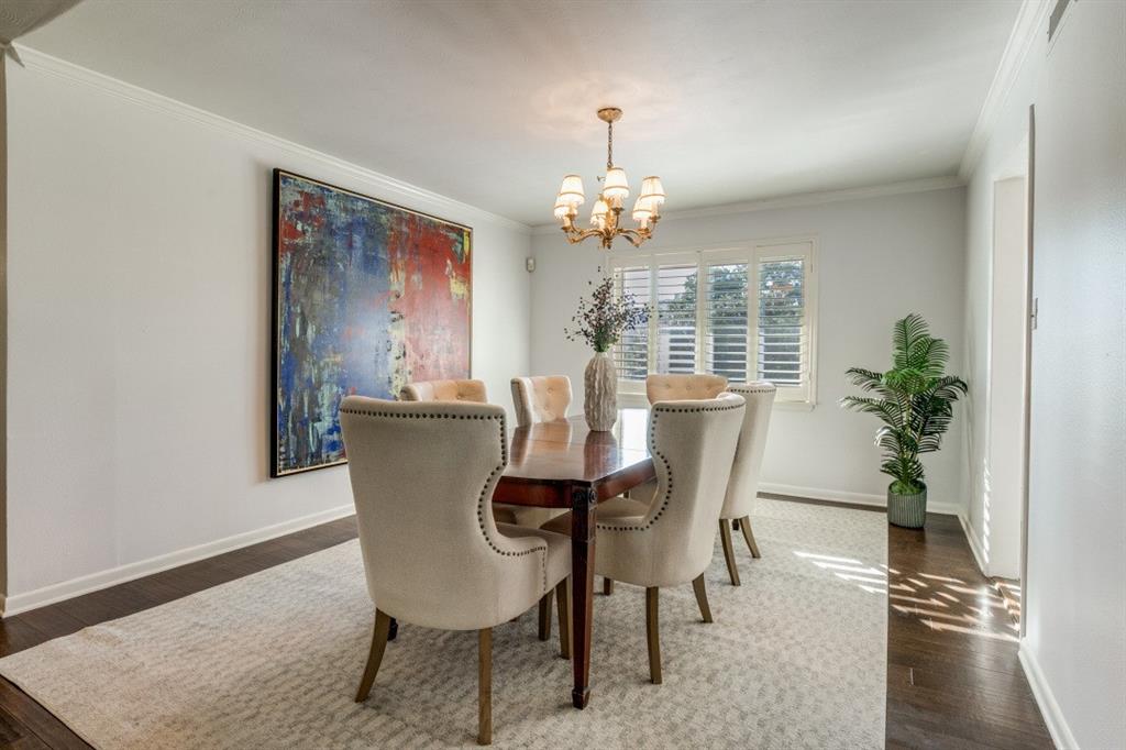 6130 Bandera Avenue, Unit C Dallas, TX 75225 - Photo 11 of 12 a dining room with furniture potted plants and wooden floor