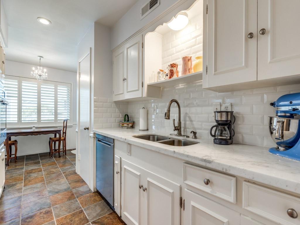 6130 Bandera Avenue, Unit C Dallas, TX 75225 - Photo 8 of 12 a kitchen with a sink and cabinets