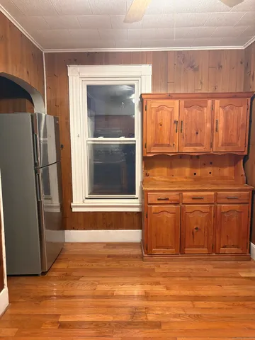 a kitchen with stainless steel appliances granite countertop a refrigerator and a stove