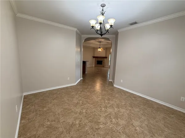 a view of a hallway with a chandelier