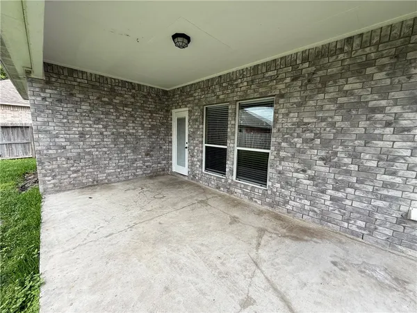 a view of a brick house with an empty space