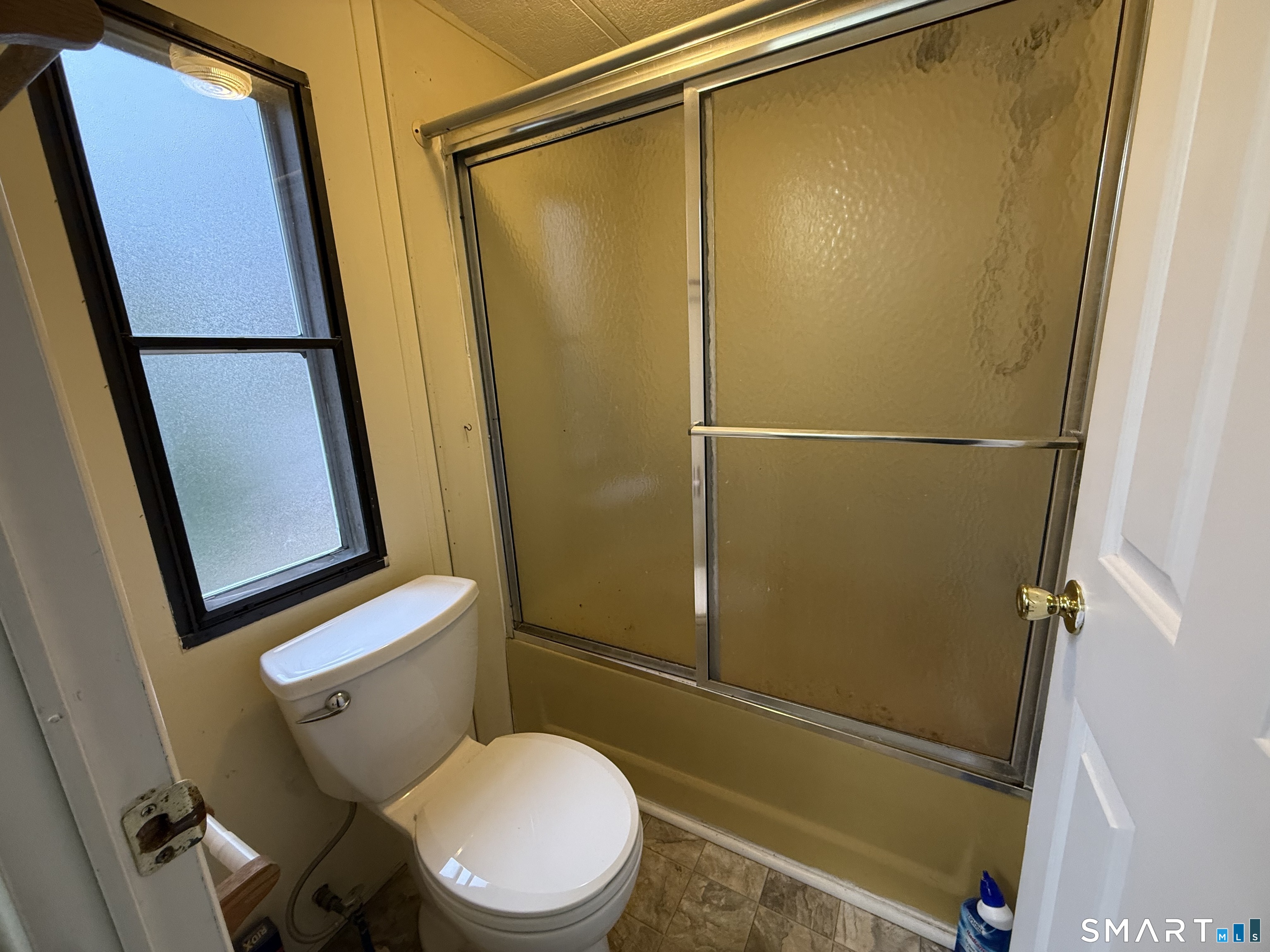 183 Whalehead Road Ledyard, CT 06335 - Photo 17 of 24 a white toilet sitting next to a shower