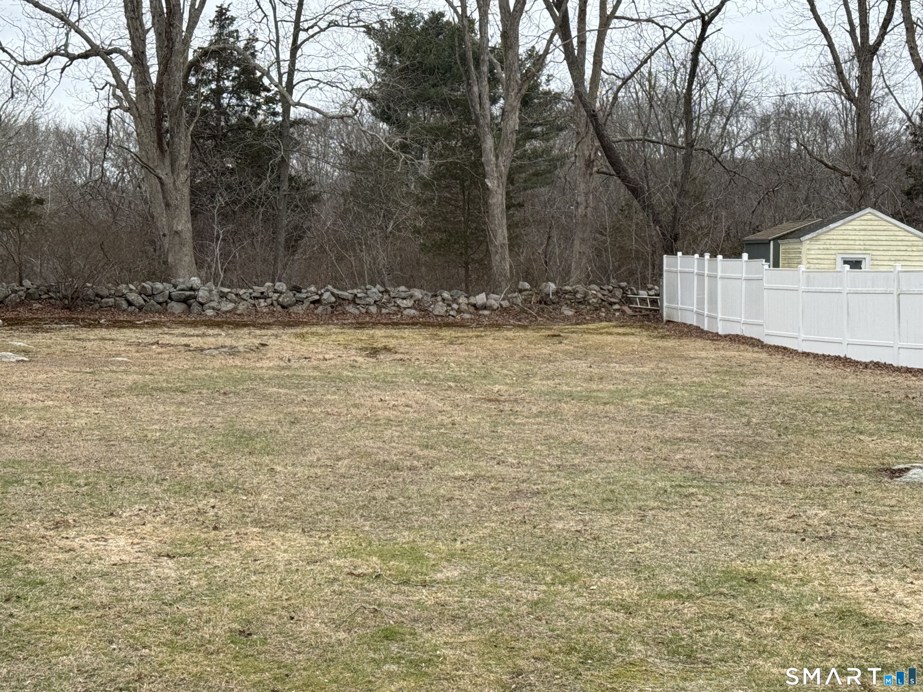 183 Whalehead Road Ledyard, CT 06335 - Photo 22 of 24 a view of yard covered with snow in front of house