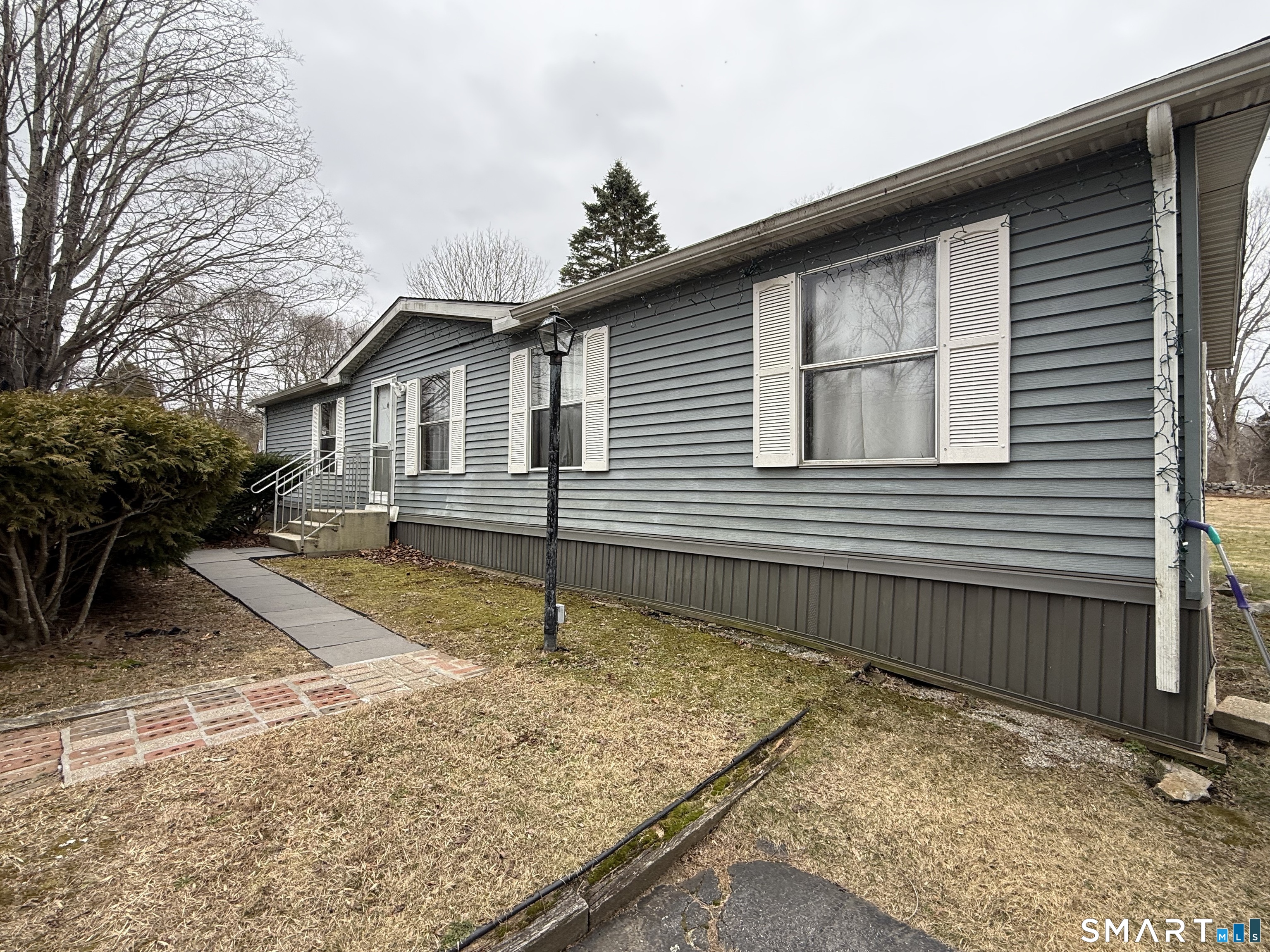 183 Whalehead Road Ledyard, CT 06335 - Photo 3 of 24 a front view of a house with a yard