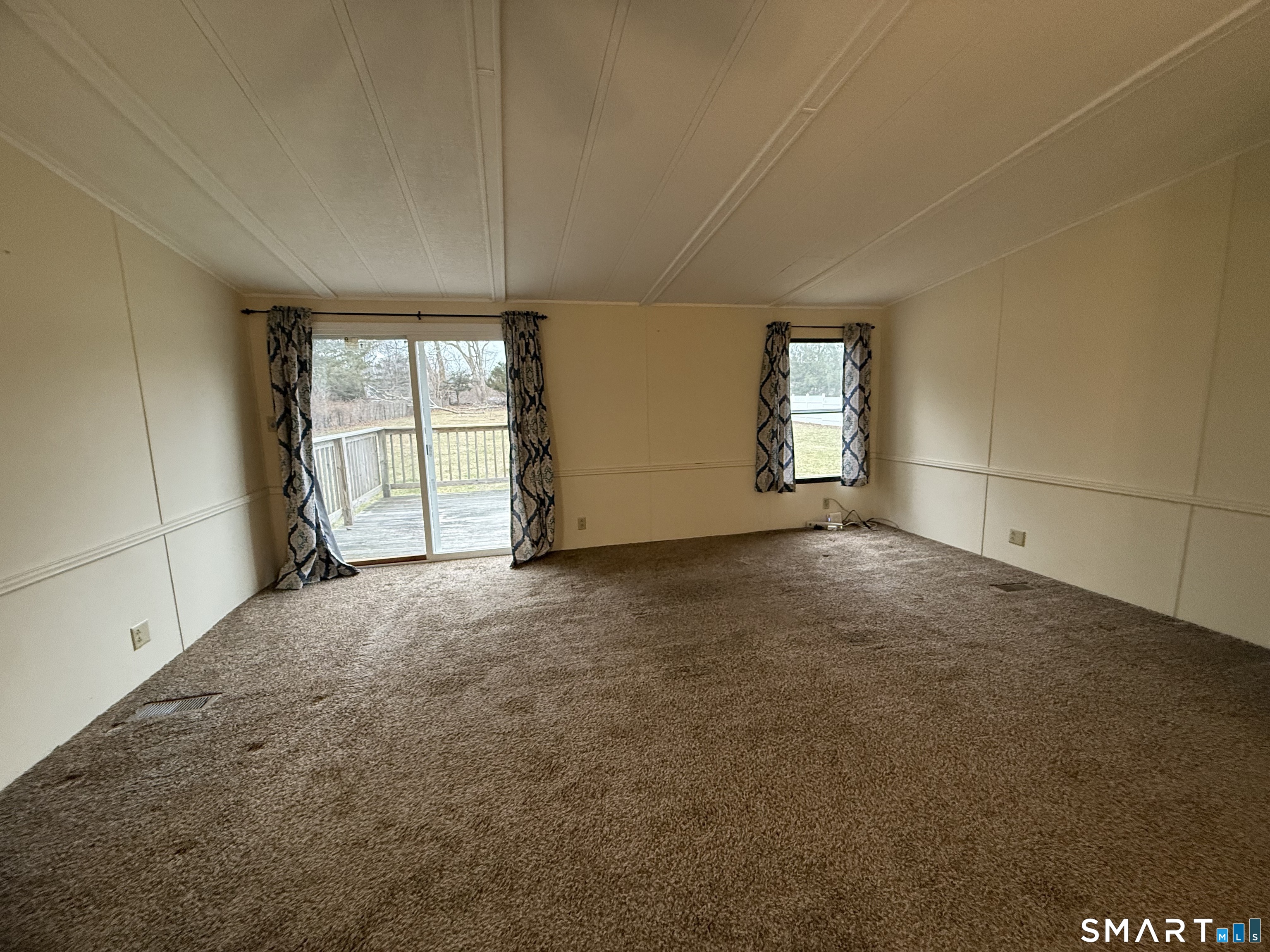 183 Whalehead Road Ledyard, CT 06335 - Photo 4 of 24 an empty room with windows