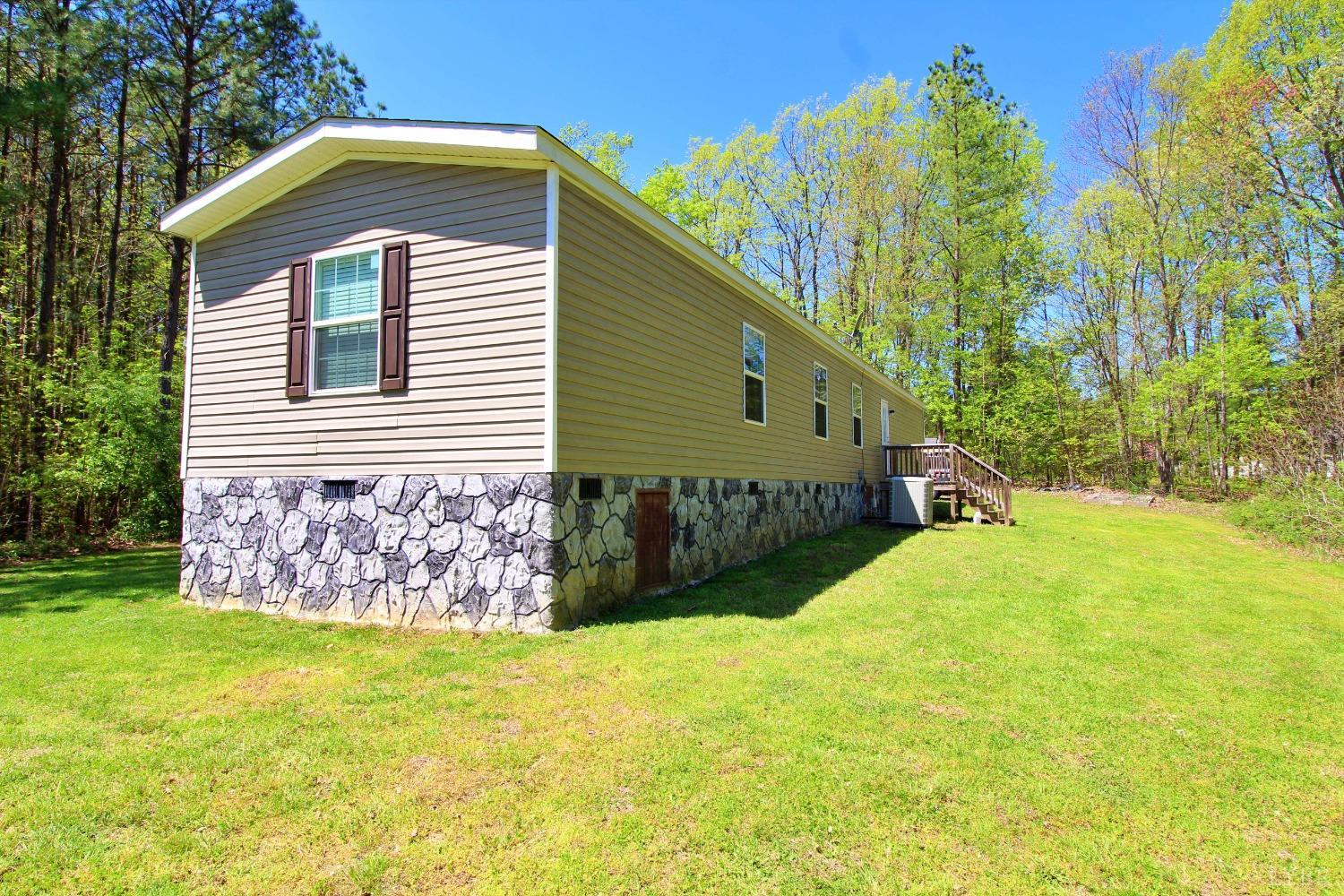 1104 Holiday Lake Road Pamplin, VA 23958 - Photo 16 of 19 a front view of a house with garden
