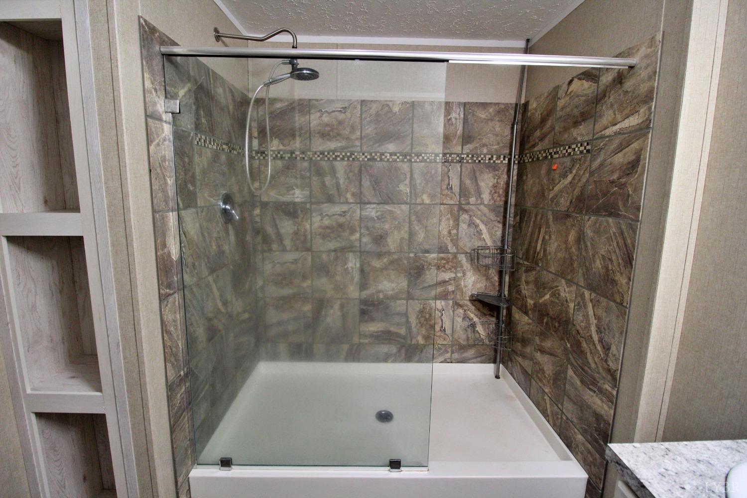 1104 Holiday Lake Road Pamplin, VA 23958 - Photo 7 of 19 a bathroom with a shower and a bath tub