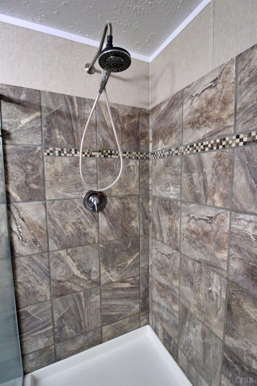 1104 Holiday Lake Road Pamplin, VA 23958 - Photo 8 of 19 a bathroom with a shower