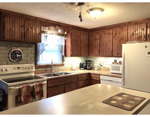 47 Starling Road Springfield, MA 01119 - Photo 8 of 29 a kitchen with kitchen island granite countertop a sink stove and refrigerator