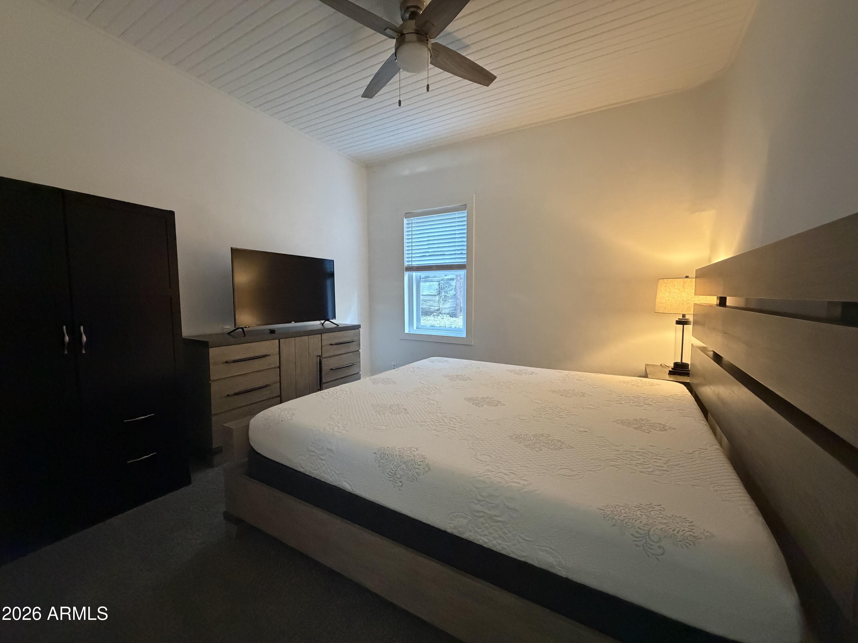 360 Pinal Street Globe, AZ 85501 - Photo 8 of 13 a bedroom with a bed and a flat screen tv