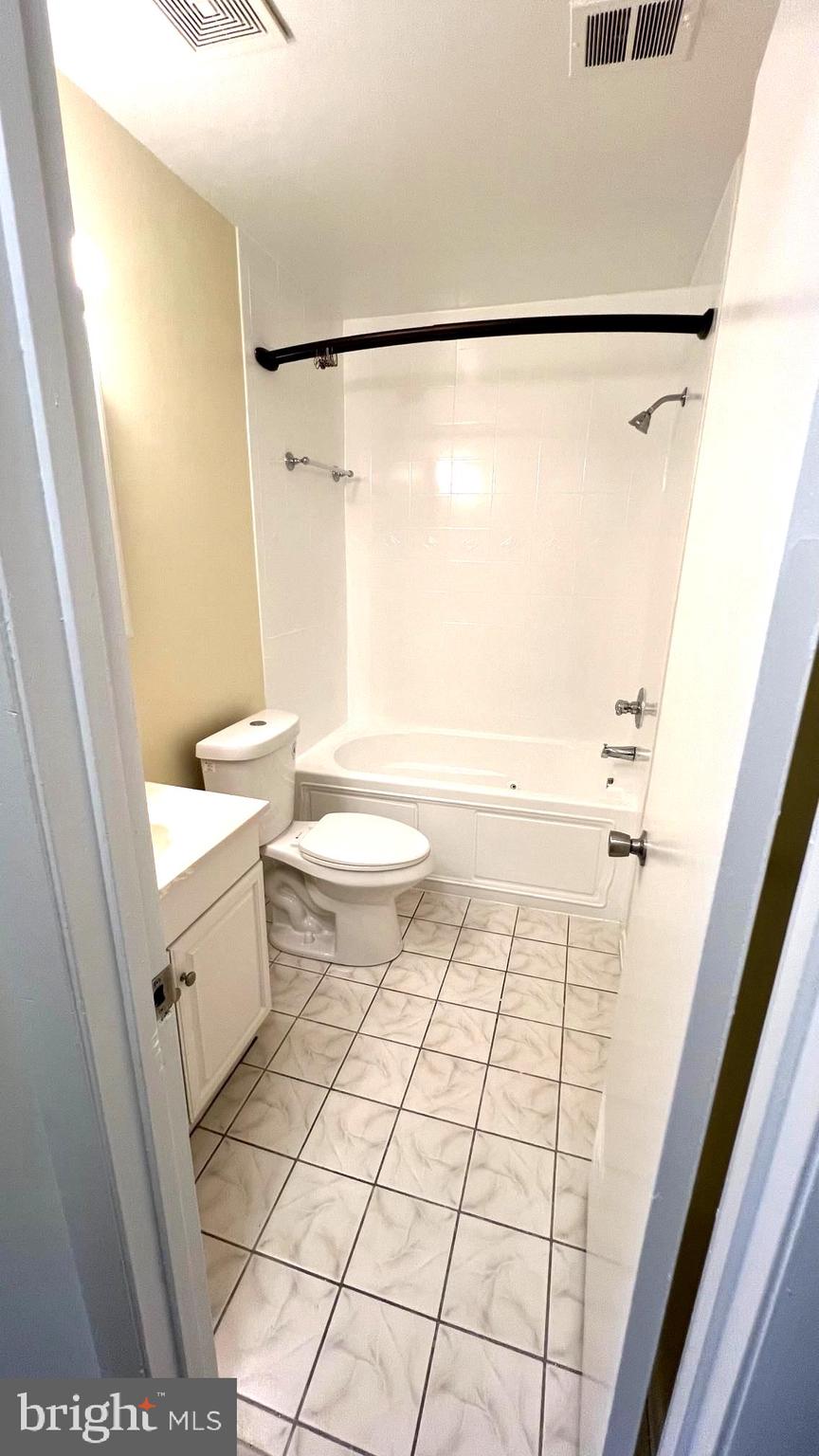 10073 Windstream Drive, Unit 5 Columbia, MD 21044 - Photo 13 of 17 a bathroom with a sink a toilet and a shower
