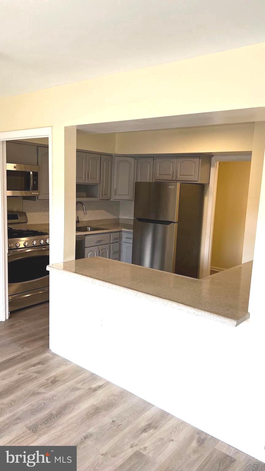 10073 Windstream Drive, Unit 5 Columbia, MD 21044 - Photo 7 of 17 a view of kitchen