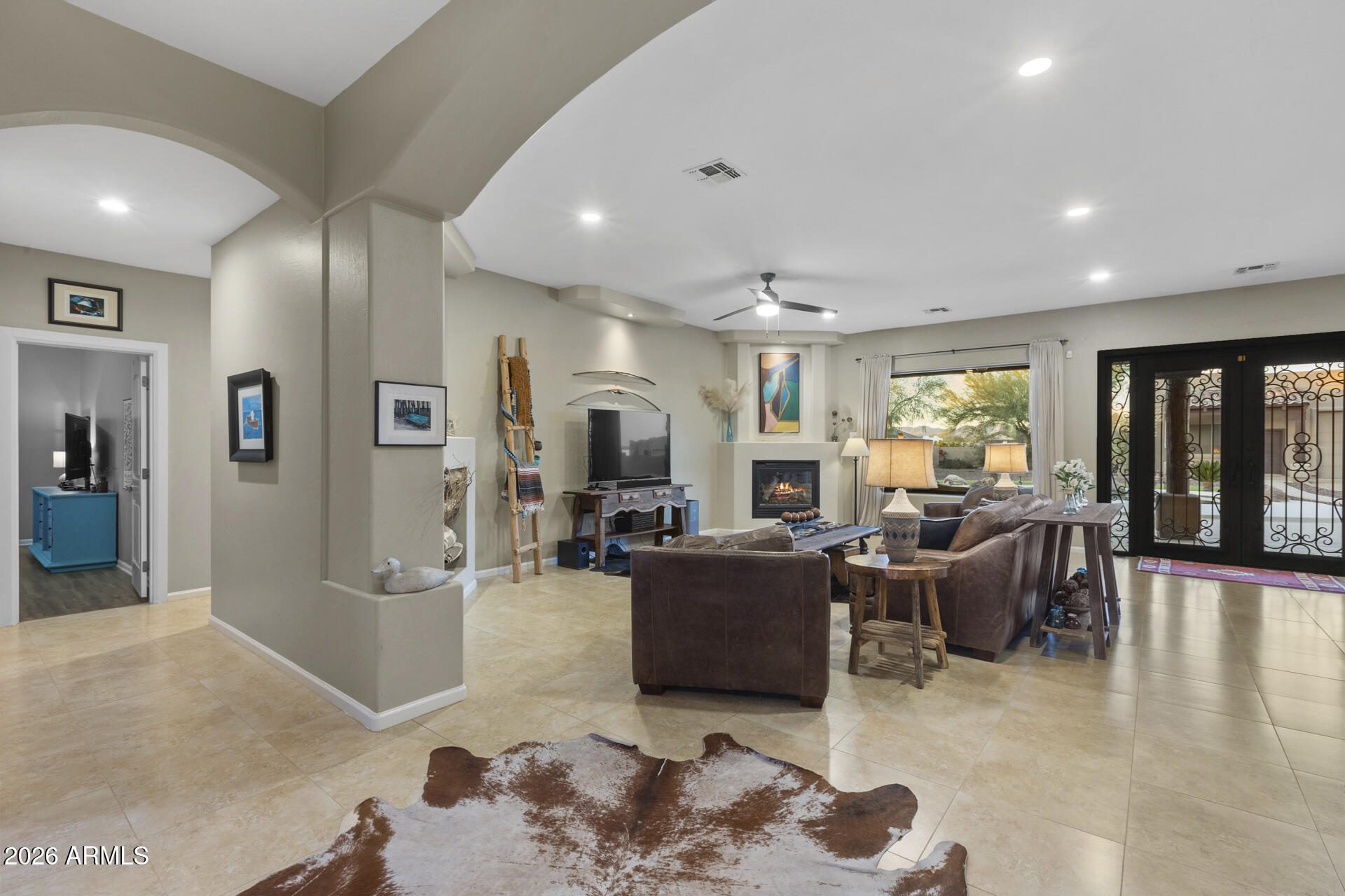 14526 West Jomax Road Surprise, AZ 85387 - Photo 12 of 57 a living room with furniture rug and window