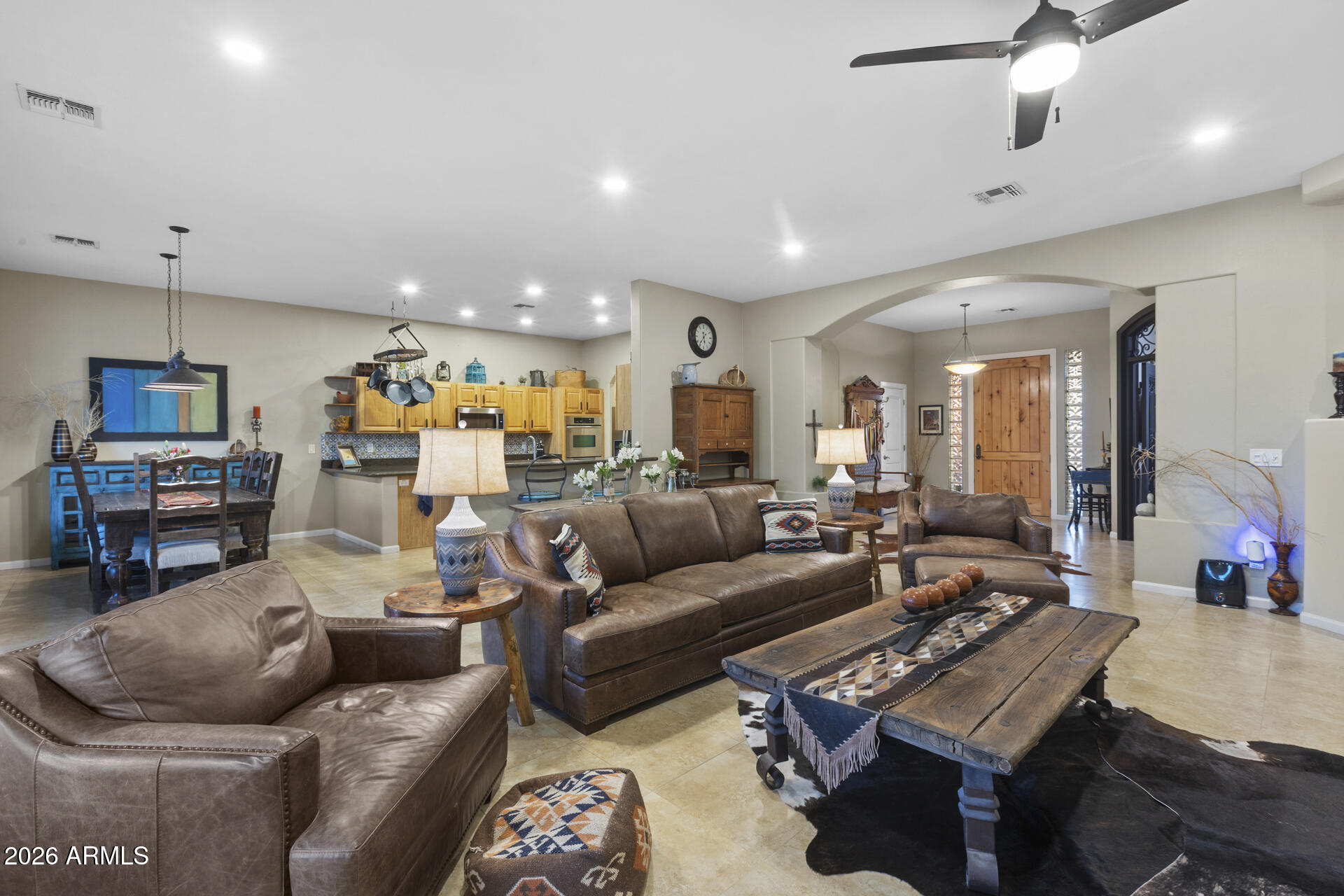 14526 West Jomax Road Surprise, AZ 85387 - Photo 15 of 57 a living room with furniture and a flat screen tv