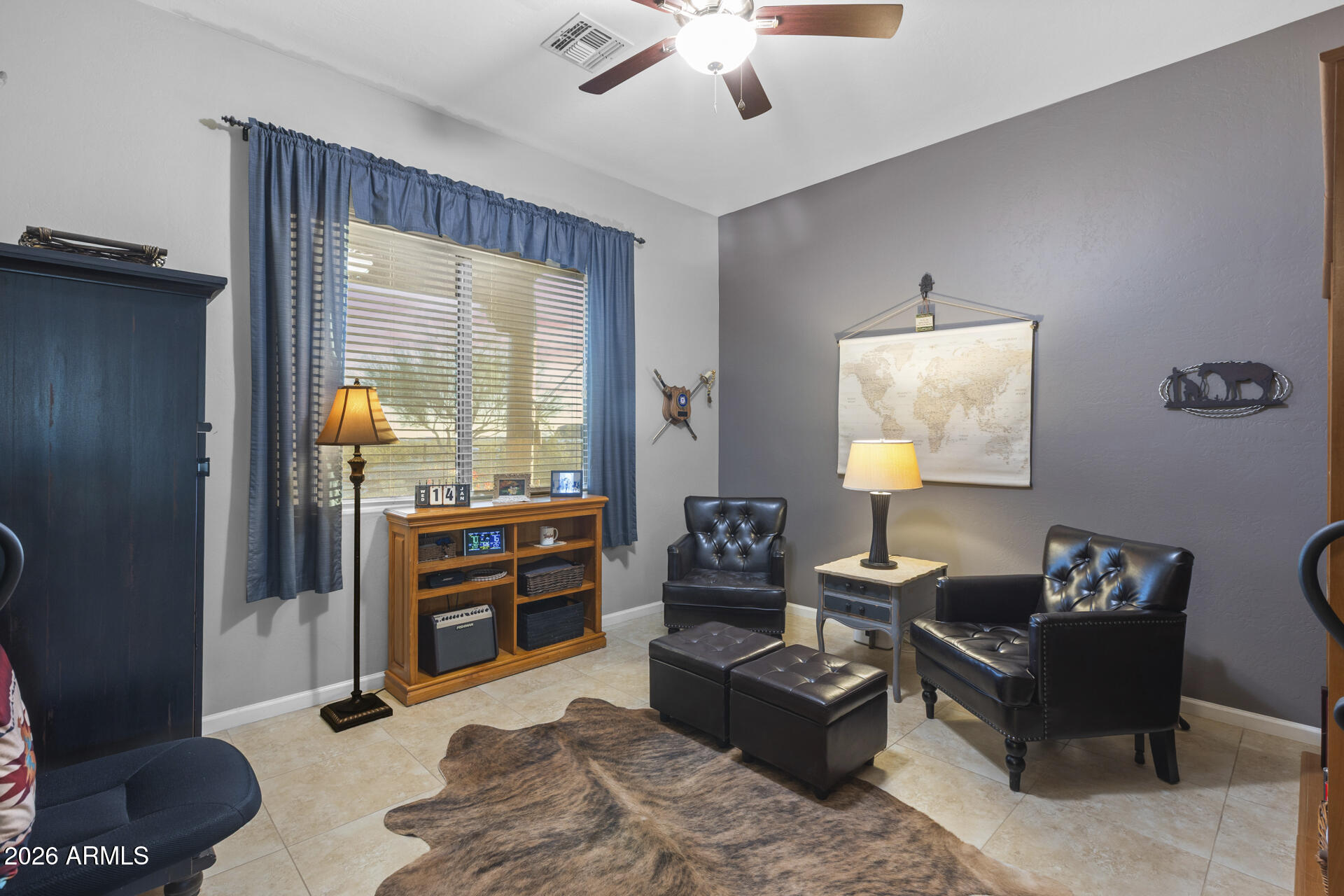 14526 West Jomax Road Surprise, AZ 85387 - Photo 22 of 57 a living room with furniture and a window