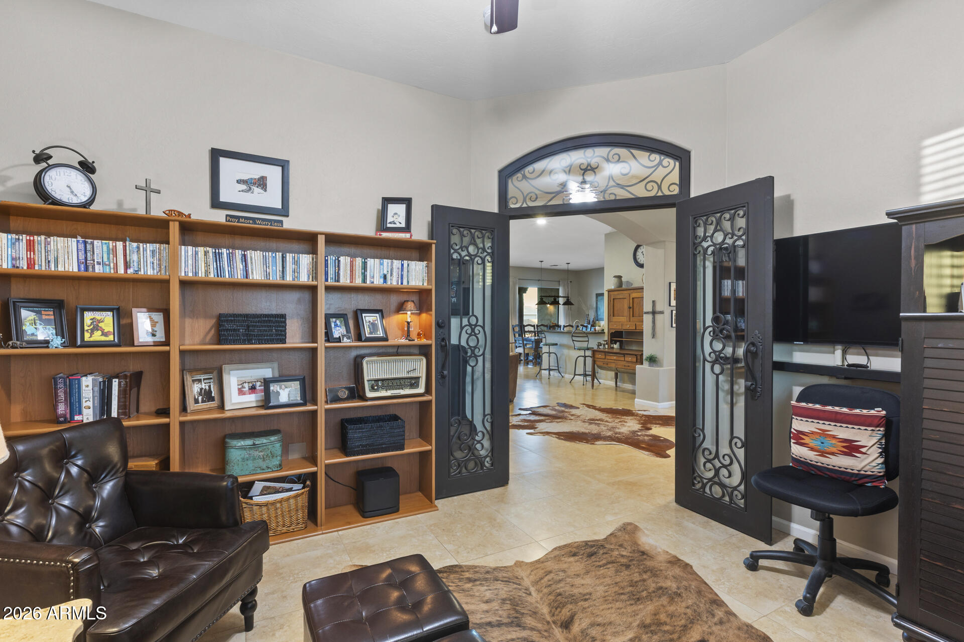 14526 West Jomax Road Surprise, AZ 85387 - Photo 23 of 57 a living room with fireplace furniture and a flat screen tv