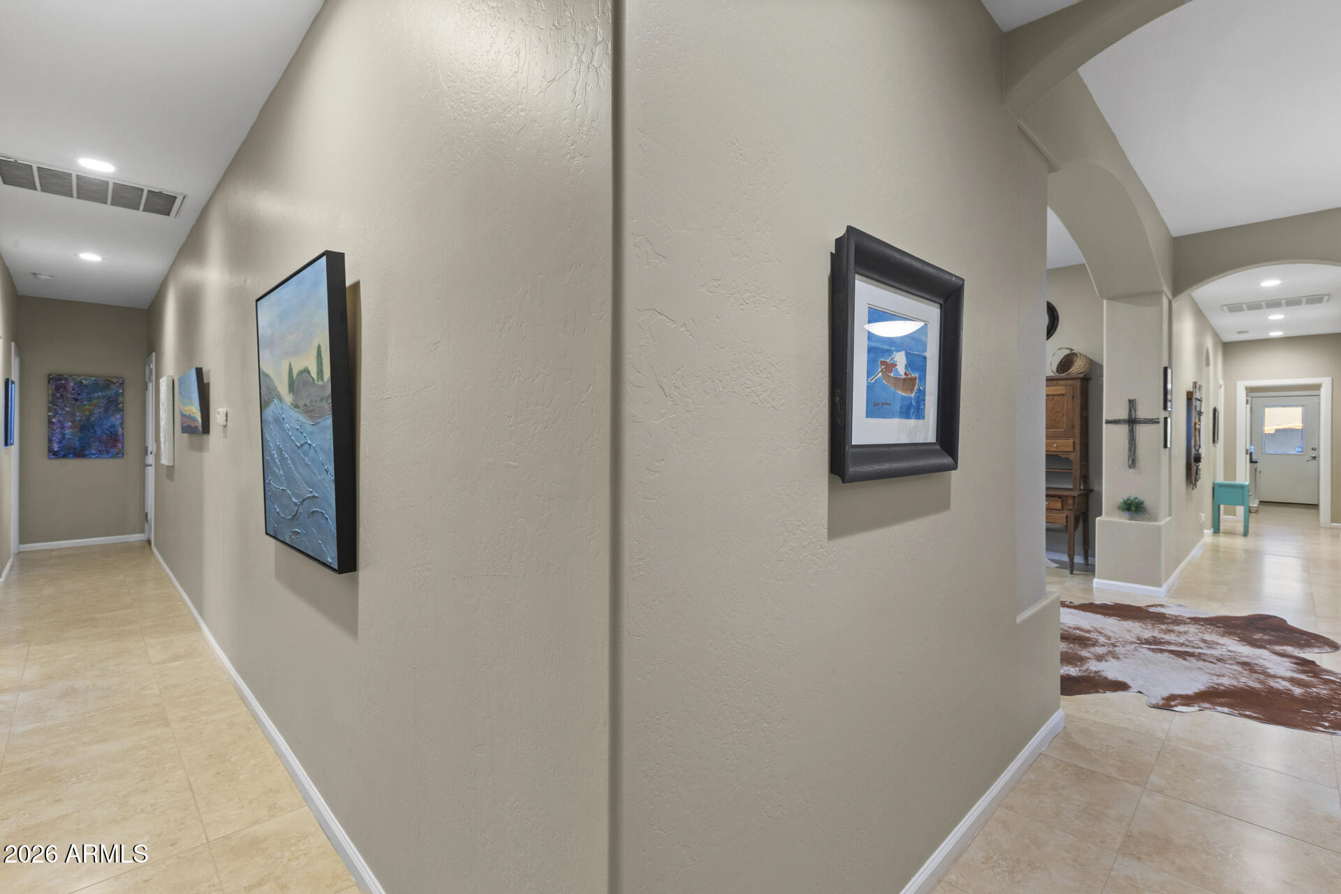 14526 West Jomax Road Surprise, AZ 85387 - Photo 24 of 57 a view of a hallway with wooden floor