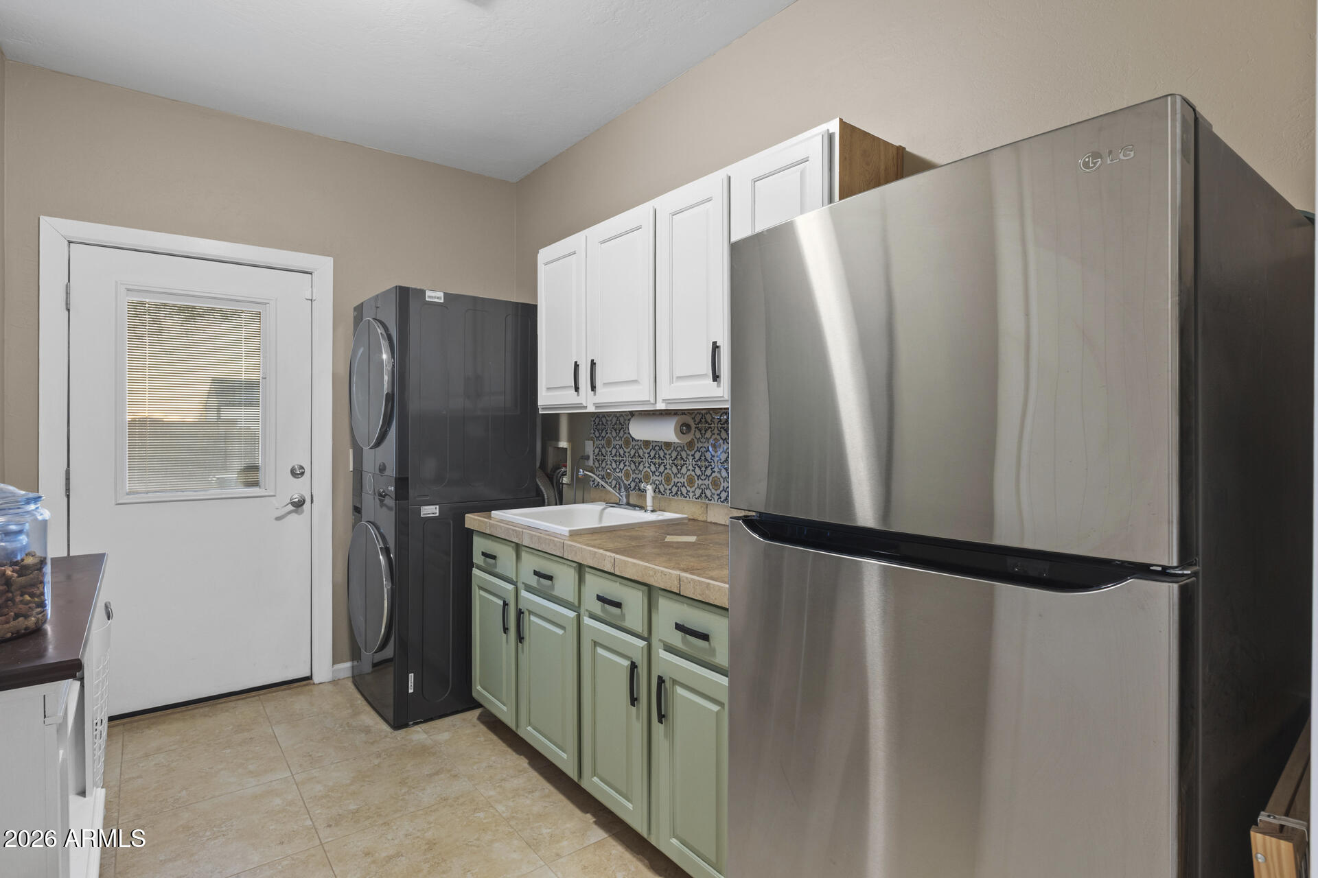 14526 West Jomax Road Surprise, AZ 85387 - Photo 31 of 57 a kitchen with stainless steel appliances granite countertop a refrigerator and a sink
