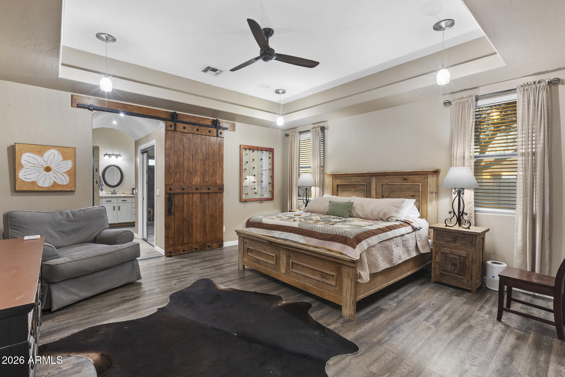 14526 West Jomax Road Surprise, AZ 85387 - Photo 32 of 57 a bedroom with a bed couch and a window