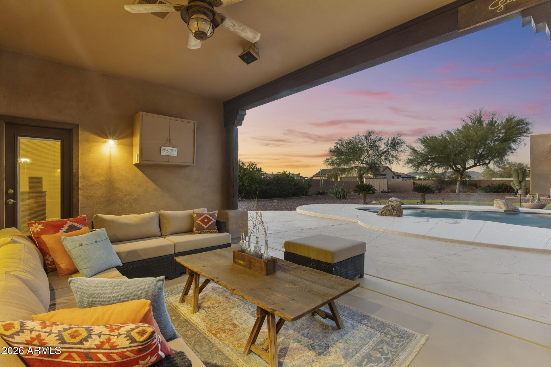 14526 West Jomax Road Surprise, AZ 85387 - Photo 36 of 57 a outdoor living space with furniture and a floor to ceiling window