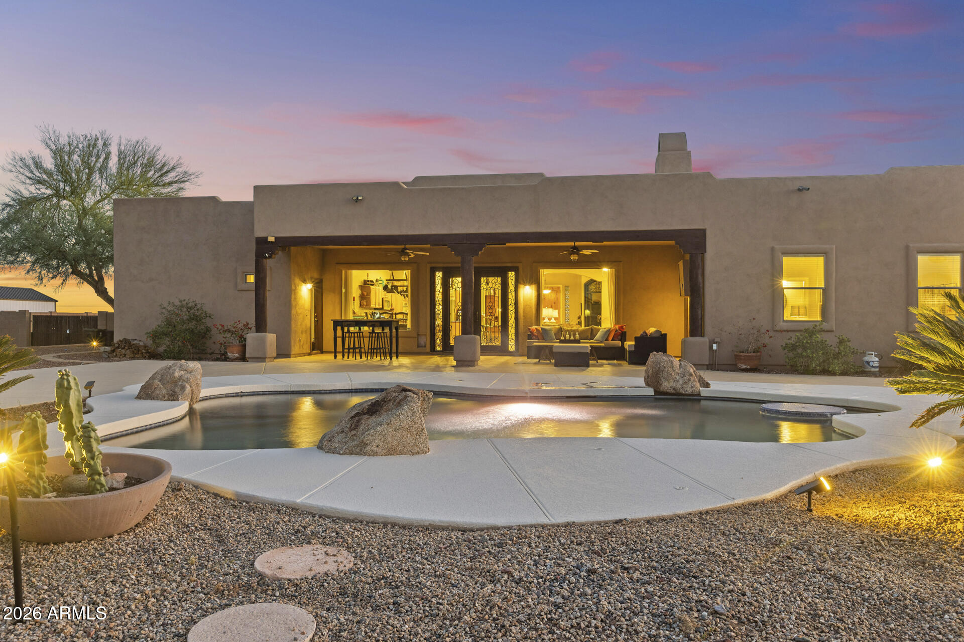 14526 West Jomax Road Surprise, AZ 85387 - Photo 40 of 57 a view of a swimming pool with a patio