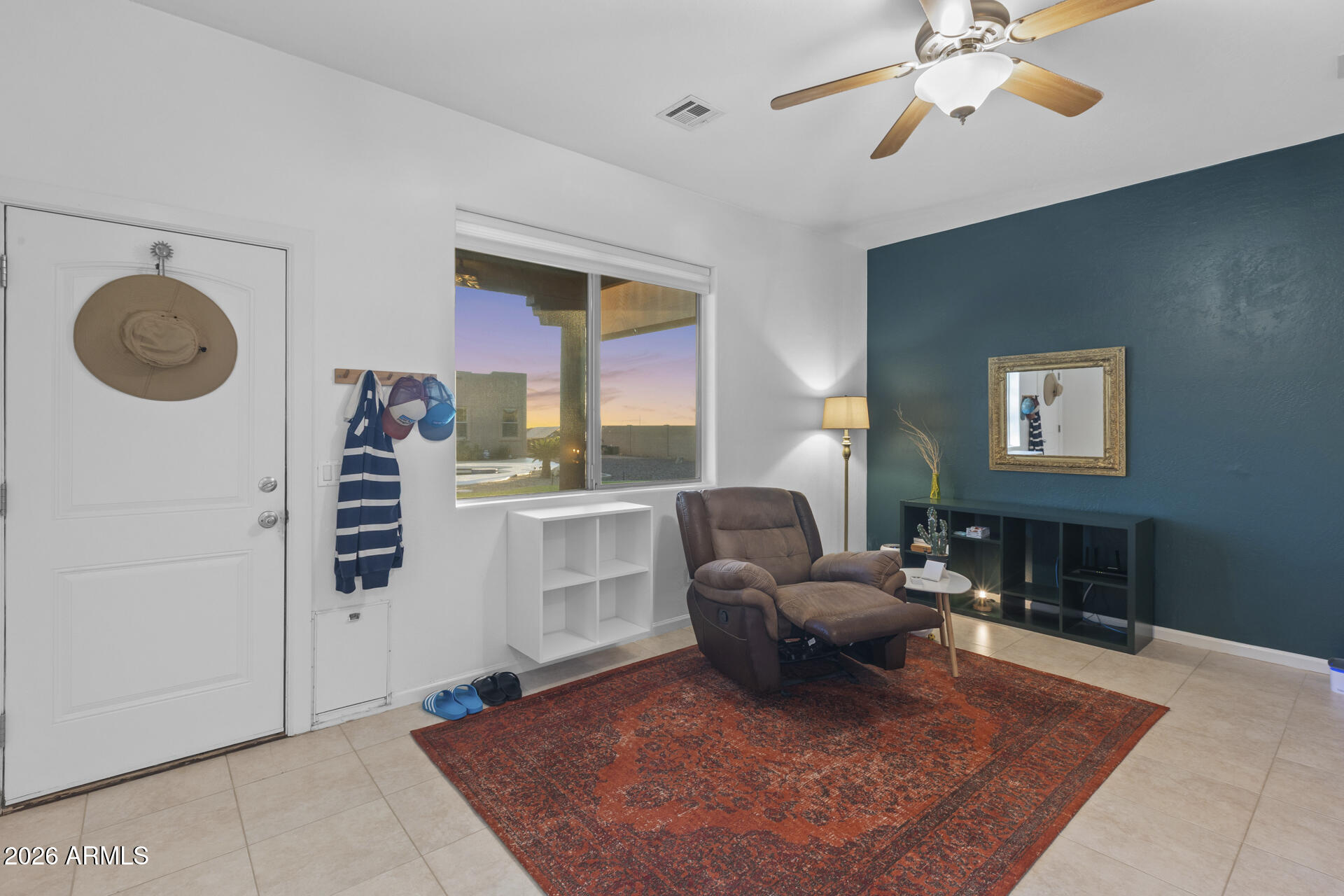 14526 West Jomax Road Surprise, AZ 85387 - Photo 45 of 57 a living room with furniture a rug and a window