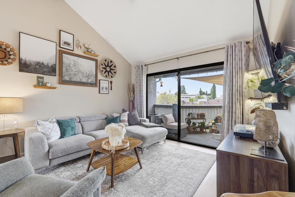 3051 Charwood Court Spring Valley, CA 91978 - Photo 1 of 20 a living room with furniture large window and a flat screen tv