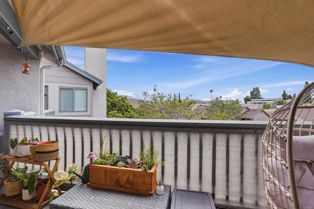 3051 Charwood Court Spring Valley, CA 91978 - Photo 14 of 20 a roof deck with table and chairs