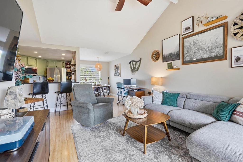 3051 Charwood Court Spring Valley, CA 91978 - Photo 2 of 20 a living room with furniture and a dining table with rug