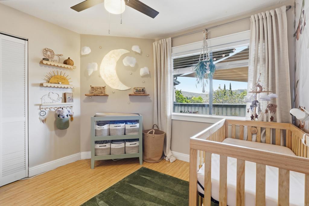 3051 Charwood Court Spring Valley, CA 91978 - Photo 7 of 20 a bedroom with furniture and a large window
