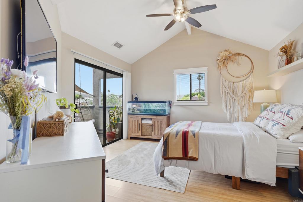 3051 Charwood Court Spring Valley, CA 91978 - Photo 8 of 20 a bedroom with a large bed and a chandelier