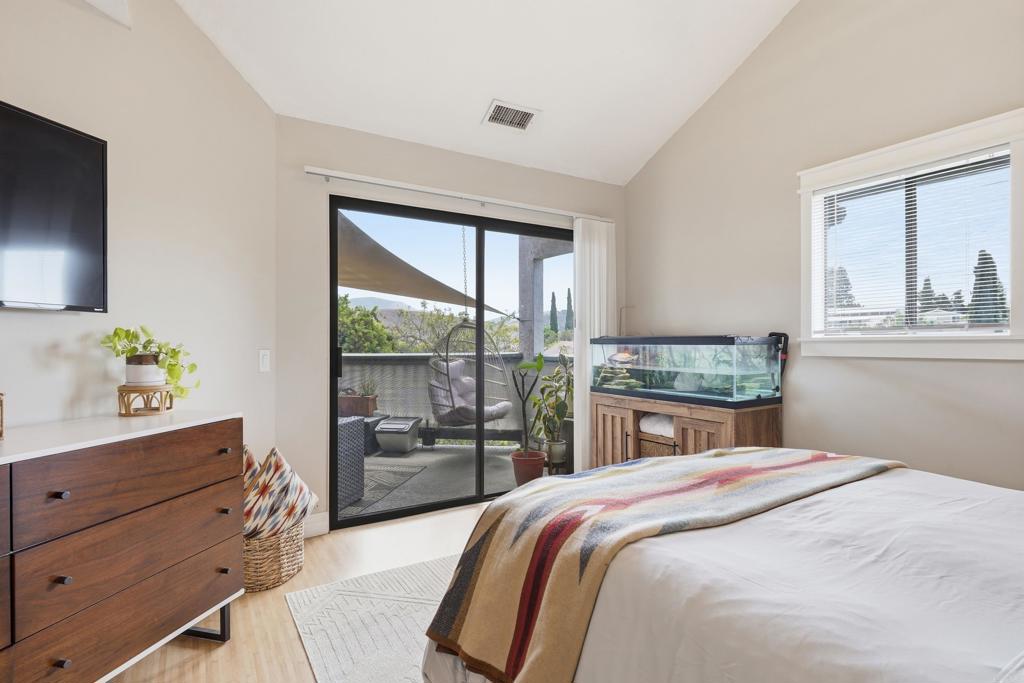 3051 Charwood Court Spring Valley, CA 91978 - Photo 9 of 20 a bedroom with a bed and a dresser next to a window