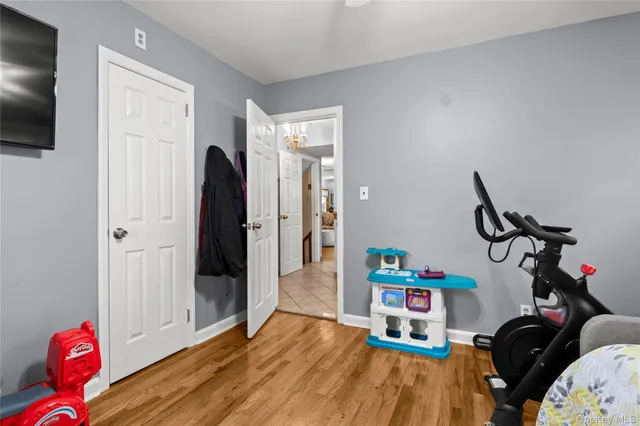 a room with furniture and a flat screen tv