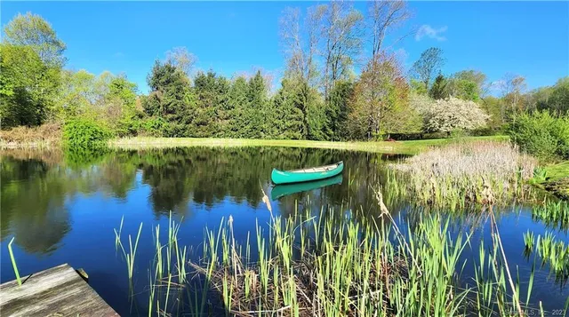a view of a lake with a house in the background