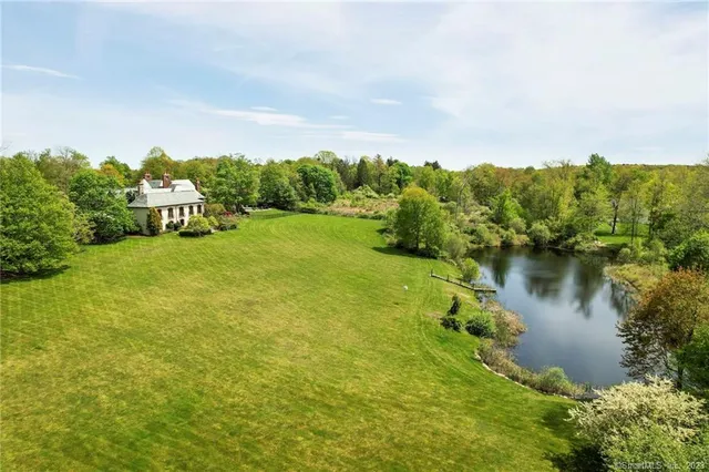 a view of a lake with houses in the background