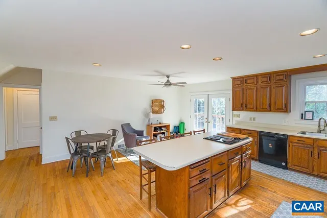 a kitchen that has a table and chairs in it