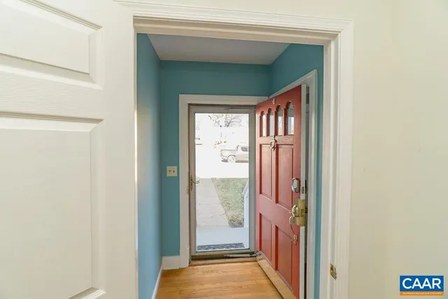 a view of a hallway with windows