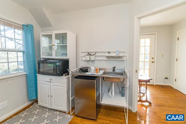 a view of a kitchen with a sink dryer and washer
