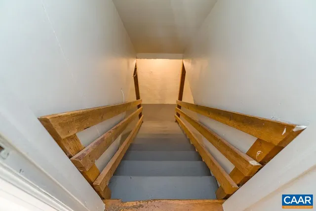 a view of an empty room with white walls