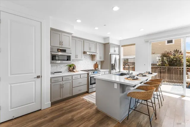 a kitchen with a table and chairs in it