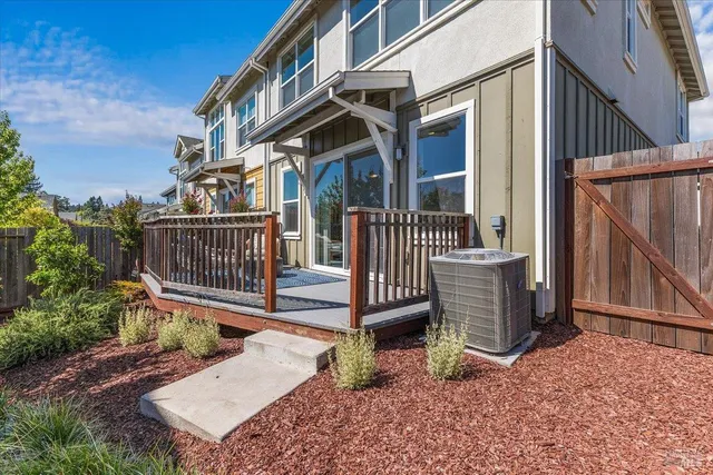 a balcony with table and chairs