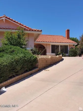 a front view of a house with yard